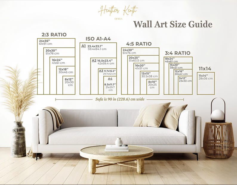May include: A wall art size guide with dimensions in inches and centimeters. The guide includes ratios such as 2:3, ISO A1-A4, 4:5, 3:4, and 11x14. The image also shows a white sofa, a round wooden coffee table, and decorative items.