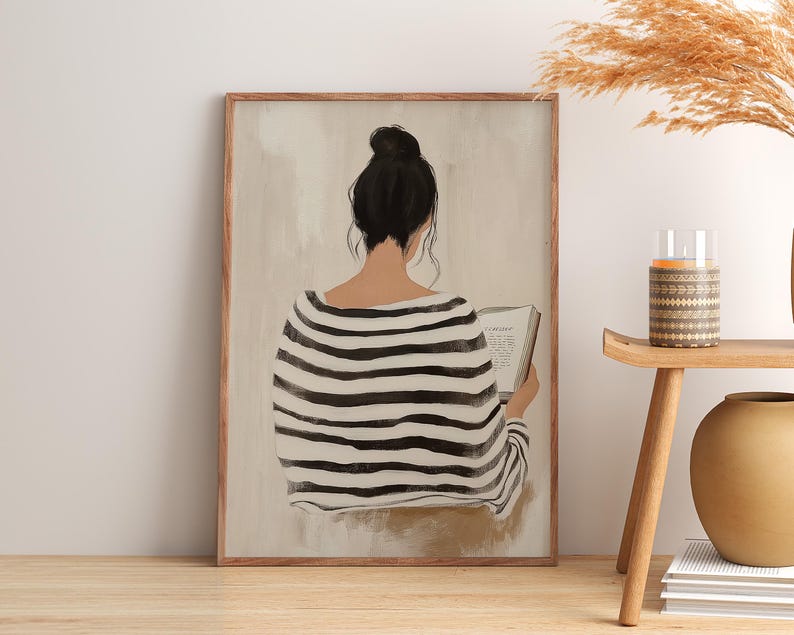 May include: A painting of a person with dark hair wearing a black and white striped shirt, sitting and reading a book. The background is a light beige color.