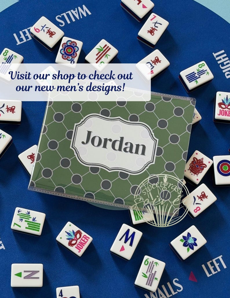 May include: A personalized green and gray Mahjong tile case with the name "Jordan" in white, surrounded by Mahjong tiles on a blue surface. The tiles have various symbols and numbers. Text on the image reads "Visit our shop to check out our new designs!"