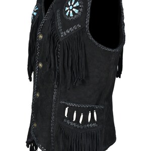 May include: Black suede vest with fringe and decorative beadwork. The vest features a V-neck, button closure, and braided trim. The design includes turquoise and white bead accents, and decorative fringe.