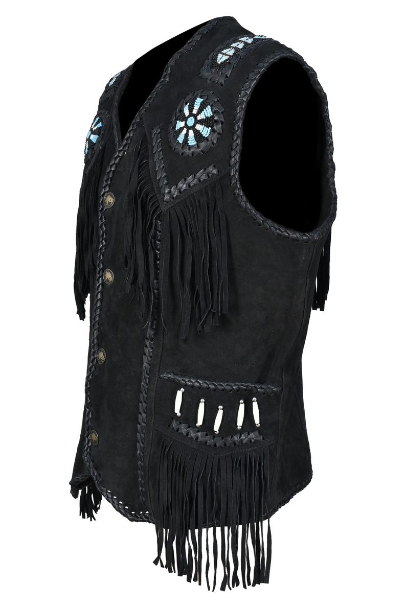 May include: Black suede vest with fringe and decorative beadwork. The vest features a V-neck, button closure, and braided trim. The design includes turquoise and white bead accents, and decorative fringe.