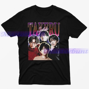 May include: Black t-shirt with a vintage-style graphic of four men. The graphic features the text "TAKERU Sato" in a pink and purple font.