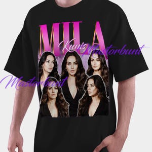 May include: Black t-shirt featuring a graphic of Mila Kunis with the name "MILA" in pink and the name "Kunis" in white script. The design includes multiple images of the actress. The shirt is a casual wear item.