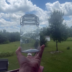 1920’s antique jar Foster Sealfast quart Jar. Clear with several air bubbles seeds.
