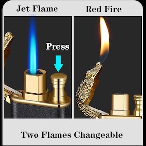 May include: A gold-toned lighter with a crocodile head design. The lighter has two flames: a blue jet flame and a red fire flame. The text "Press" with a downward arrow is visible on the lighter. The text "Two Flames Changeable" is also visible.