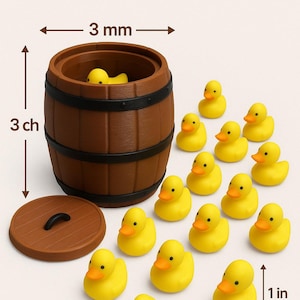 May include: A 3D-printed brown barrel with a lid, containing a yellow duck. Twenty small yellow ducks with orange beaks are scattered around the barrel. The barrel is 3 inches high and 1 inch wide. The text reads "BARREL OF OUACKS".