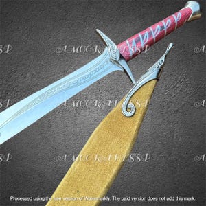 May include: A detailed image of a sword with a silver blade and a red and silver handle. The sword has an inscription on the blade and is partially sheathed in a gold-colored scabbard. The handle has a red wood grain pattern.