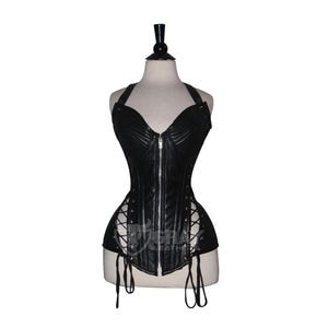 May include: A black leather corset with a halter neck and a front zipper. The corset has a structured bodice and is laced up on the sides. The garment is displayed on a mannequin.