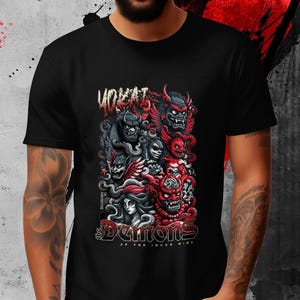 May include: Black t-shirt featuring a detailed graphic of stylized demons in red, gray, and black. The design includes the text "YOKAI" above and "The Demons of the Inner Mind" below the central illustration.