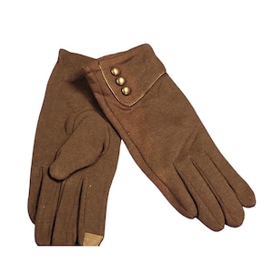May include: A pair of brown gloves with a gold-colored trim and three gold-colored buttons on the cuff. The gloves are made of a soft material and appear to be for cold weather. The gloves are shown on a white background.