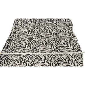 May include: A piece of fabric with a zebra stripe pattern in black and white. A measuring tape is laid across the fabric, showing a length of approximately 43 inches.