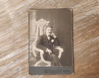 Man portrait,  vintage photo mounted on cardboard, sepia tone, 1940s