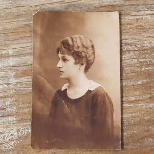 Vintage studio photo, woman portrait, sepia tone image 1