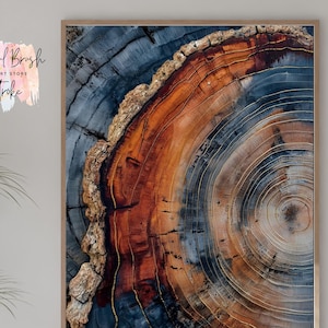 May include: A framed wall art print featuring a close-up view of a tree trunk cross-section. The artwork showcases concentric rings in shades of brown, orange, and blue, with gold accents. The text "Colorful Brush Wall Art Store Stroke" is in the upper left corner.