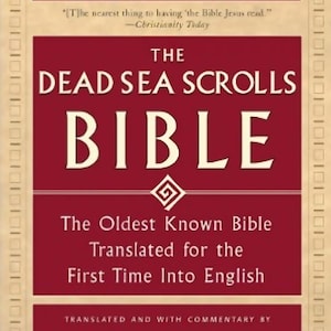 May include: A book cover with the title "The Dead Sea Scrolls Bible" in large white letters on a maroon background. The cover includes text about the book's content and the translators.