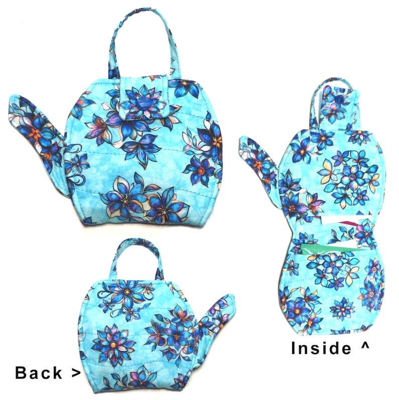 May include: A quilted, light blue handbag with a floral pattern in shades of blue, purple, and white. The bag has a handle and a spout-like extension. The image shows the front, back, and inside of the bag. The text "Back >" and "Inside ^" are visible.