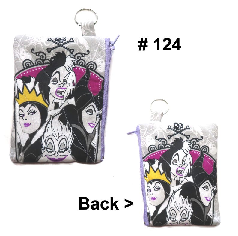May include: A small, square coin purse with a zipper closure and a key ring. The front features a colorful graphic of Disney villains, including Cruella de Vil and Ursula. The background is a light gray with a spiderweb pattern. The text "# 124" is visible.