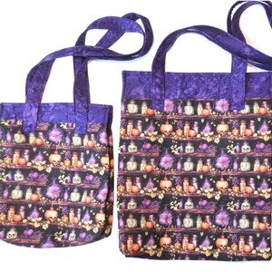 May include: Two fabric tote bags with purple handles and a top border. The main body features a repeating pattern of shelves holding various glass bottles, skulls, and orange pumpkins against a black background. The bags are rectangular in shape.