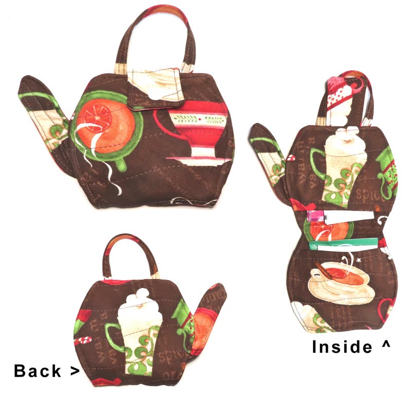 May include: Brown quilted teapot-shaped purse with a handle. The purse features a flap closure and is decorated with coffee and tea-themed patterns in red, green, and white. The inside of the purse has pockets for storage.