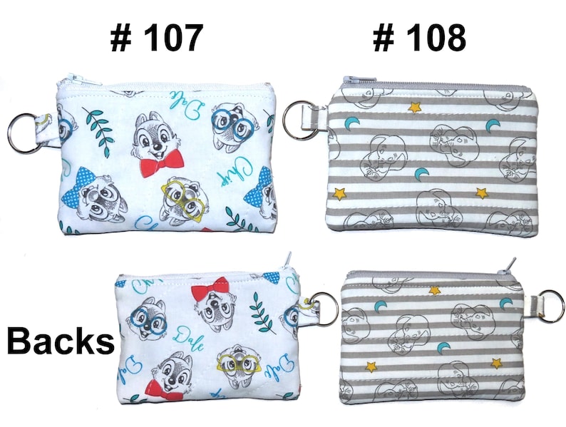 May include: Two small, rectangular coin purses with zippers and key rings. One is white with Chip and Dale cartoon characters and the text "Chip" and "Dale". The other is gray and white striped with cartoon character outlines, moons, and stars. The word "Backs" is printed on the bottom left.