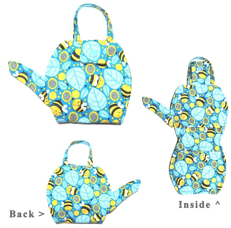 May include: A blue, bee-themed fabric watering can-shaped bag with a handle. The bag features a pattern of bees, sunflowers, and leaves. The inside of the bag is also visible, showing the same pattern. The text "Back >" and "Inside ^" are also visible.