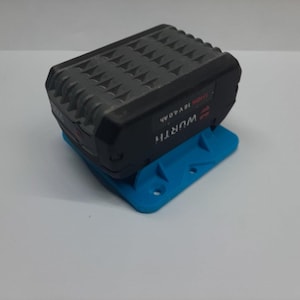 Puede incluir: Un soporte de batería impreso en 3D azul para una batería Worx 18V 4.0Ah negra.