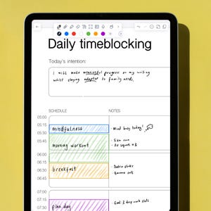 May include: A digital tablet screen displaying a daily time-blocking schedule with handwritten notes. The schedule includes activities like mindfulness, morning workout, breakfast, and plan day. The notes include details like "Mind busy today!" and "Goal: 3 deep work slots".