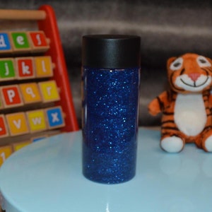 Blue Glittery Sensory Bottle for Kids Learning Development | Handmade Gift to Entertain and Calm Children&#39;s Sensory Needs.