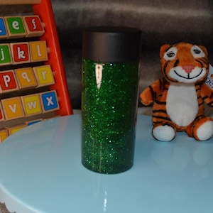Green Glittery Sensory Bottle for Kids Learning Development | Handmade Gift to Entertain and Calm Children&#39;s Sensory Needs.