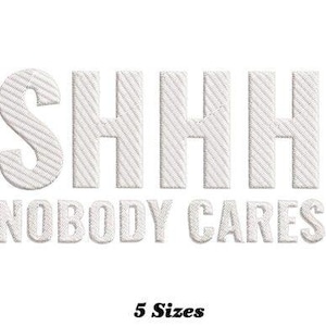 Puede incluir: Diseño bordado en blanco con el texto "SHHH NOBODY CARES" en una fuente blanca texturizada. El texto está en mayúsculas. El diseño está disponible en 5 tamaños.