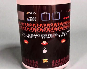 It’s Dangerous to Go Alone Zelda Coffee Mug – 15 oz Video Game Cup – Funny Gamer Gift – Pixel Art Retro Gaming Mug - Legend of Zelda Link