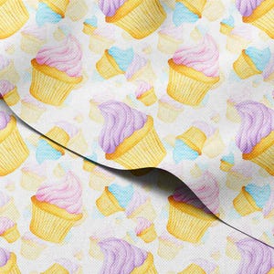 May include: Watercolor pattern featuring cupcakes with pink and purple frosting, yellow cupcake liners, and light blue accents on a white background. The design includes various sizes of cupcakes, creating a repeating pattern.