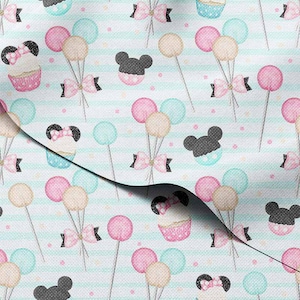 May include: Fabric with a repeating pattern of cupcakes, balloons, bows, and Mickey Mouse silhouettes. The cupcakes are pink and blue with black mouse ears. Balloons are pink, beige, and blue. The background has light blue stripes.