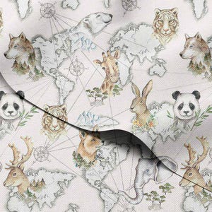 May include: A light-colored fabric featuring a world map design with watercolor illustrations of various animals. The animals include a wolf, polar bear, giraffe, tiger, rabbit, panda, fox, elephant, and deer. Compass rose details are also present.