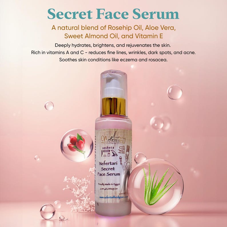 May include: A clear glass bottle with a gold lid and a pink label. The label says "Nefertari Secret Face Serum" and is decorated with Egyptian hieroglyphs. The bottle is sitting on a pink background with a rosehip and an aloe vera plant.