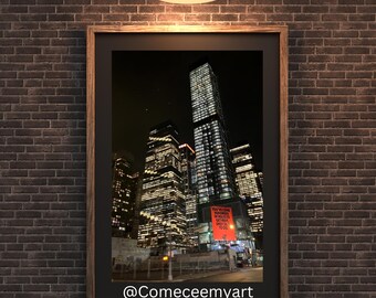 May include: A framed photograph of a city skyline at night. The buildings are lit up and there are stars in the sky. The text "YOU'RE WELCOME TO THE WONDERFUL WORLD OF GET ME A DELICIOUS FOOD" is on a red sign in the bottom right corner of the image.