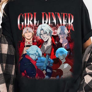 May include: Black t-shirt with a graphic print of five anime characters in red and white. The text "GIRL DINNER" is printed in white letters with a red outline.