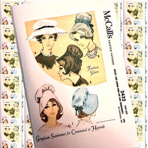 May include: A vintage McCall's printed pattern featuring illustrations of various hats and sunbonnets. The cover art showcases stylish women wearing different hat designs, with text including "Fashion Sheers" and "Gingham Sunbonnet".