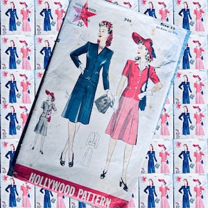 May include: A vintage sewing pattern for a dress with a red, white, and blue color scheme. The pattern is for size 12, with a 30 inch bust and 33 inch hips. The pattern is titled "Hollywood Pattern" and has a price of 25 cents.