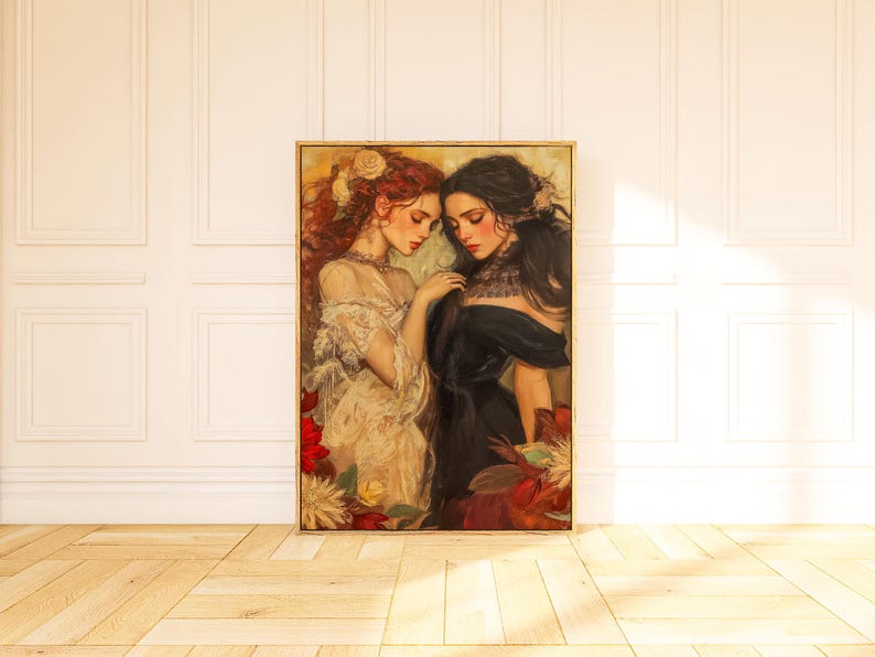 May include: A framed painting featuring two women in elegant attire. One woman has red hair and wears a cream-colored dress, while the other has black hair and wears a black dress. The artwork is surrounded by floral elements.