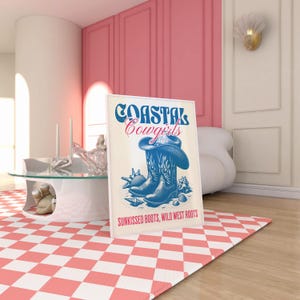 May include: A white poster with blue text that reads "Coastal Cowgirls" and a drawing of blue cowboy boots with a cowboy hat on top of the boots. The text at the bottom of the poster reads "Sunkissed Boots, Wild West Roots."