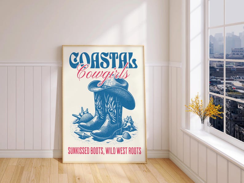 May include: A white poster with blue and red text that reads "Coastal Cowgirls" and a drawing of a blue cowboy boot with a brown cowboy hat. The text at the bottom reads "Sunkissed Boots, Wild West Roots."