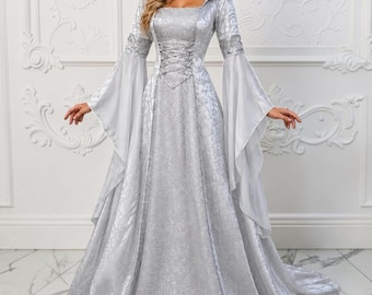 May include: A floor-length silver dress featuring a hood, long flared sleeves, and a corset-style lace-up bodice. The garment is crafted from a shimmering fabric with a subtle tonal floral pattern, extending into a full skirt with a train.