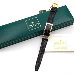 Gucci Ref. 52000M Rectangular Watch – Black Dial – Gold and Steel – 21x52mm – Leather Strap – Box & Warranty – Never Worn