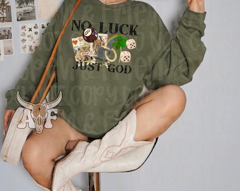 May include: A green sweatshirt with the text "No Luck Just God" and a graphic of a pool ball, playing cards, a horseshoe, and dice.