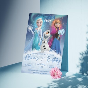 May include: A Frozen-themed birthday party invitation featuring Elsa, Anna, and Olaf. The invitation includes the text "Frozen Party" and "Olivia's 7th Birthday". The invitation is light blue with a pink flower in the bottom right corner.