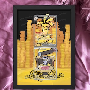 May include: Black framed artwork featuring two trading cards with cartoon characters against a gold coin background. The top card shows a banana-like character, and the bottom card depicts a ghost-like figure in a treasure chest. The text "cards are not included" is at the bottom.