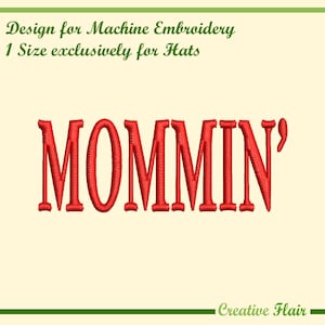 May include: A light yellow background features red embroidered text spelling "MOMMIN'" in a bold font. The text "Design for Machine Embroidery 1 Size exclusively for Hats" is above. The words "Creative Flair" are at the bottom in green.