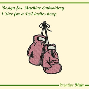 May include: Machine embroidery design featuring two pink boxing gloves hanging by black strings. The design is for a 4x4 inches hoop. The text "Design for Machine Embroidery" and "Creative Flair" are also visible.