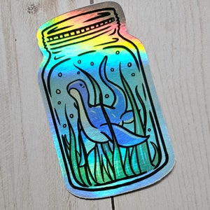 Cryptid Buddy Holographic Sticker Fantasy Art Loch Ness Monster Jar Sticker Nessie Weird Cottagecore Cryptidzoology Cryptozoology Sea Dino